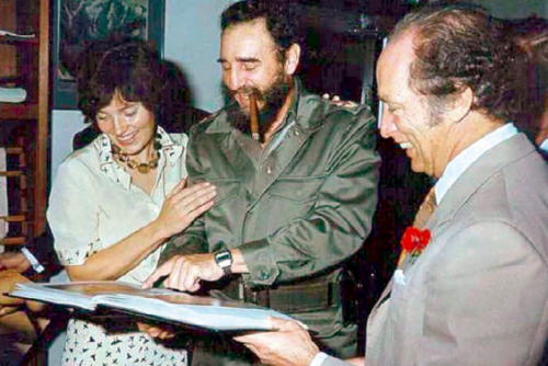 Margaret with both arms around Castro.png